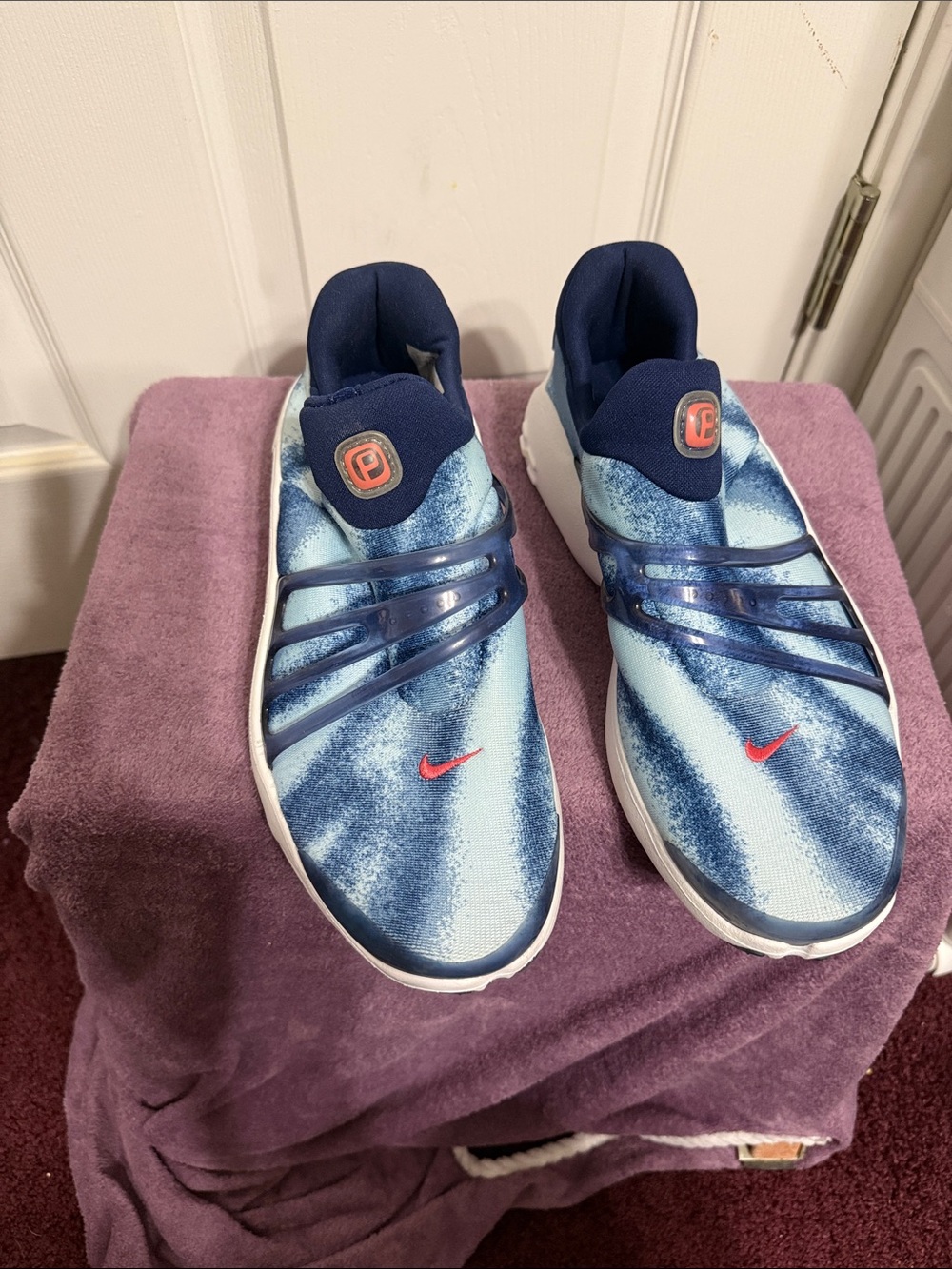 Nike Blue Tie-Dye Slip-On Sneakers with Red Swoosh Accent